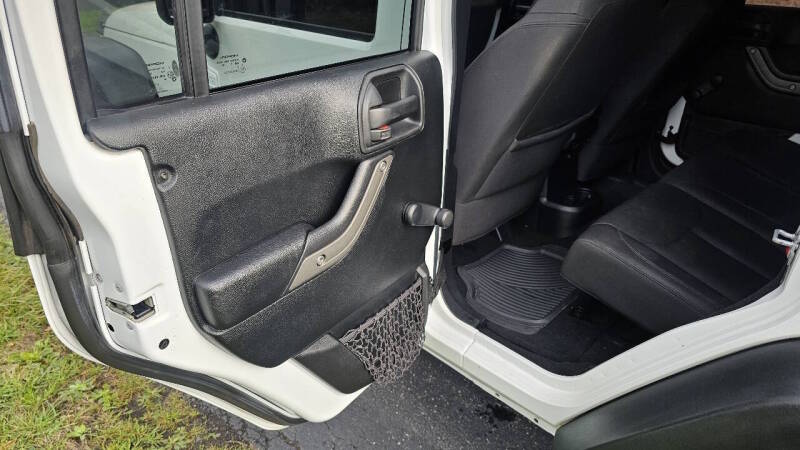 Jeep Wrangler Unlimited for sale at Arcia Services — photo 16