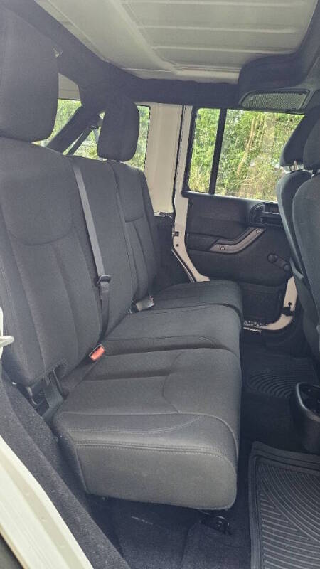 Jeep Wrangler Unlimited for sale at Arcia Services — photo 21
