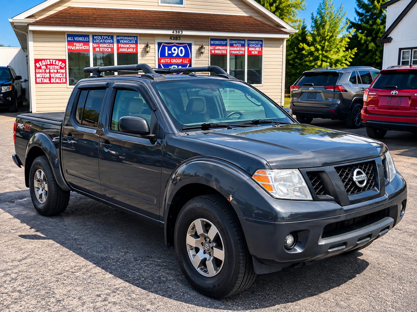 2011 Nissan Frontier for sale at I90 Auto Group LLC