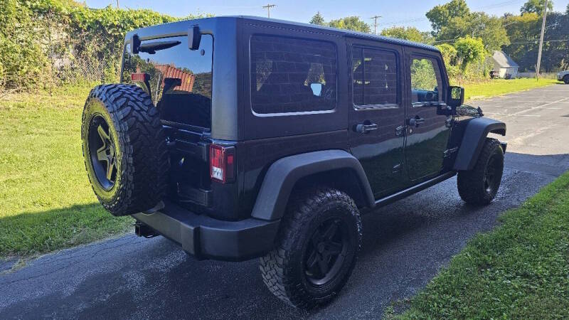 Jeep Wrangler Unlimited for sale at Arcia Services — photo 5